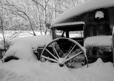 old truck and wheel in snow