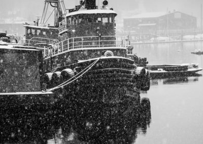 tugboat in snow bw